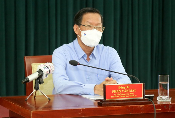 Phó bí thư thường trực Thành ủy Phan Văn Mãi tại cuộc họp báo thông tin về tình hình dịch Covid-19