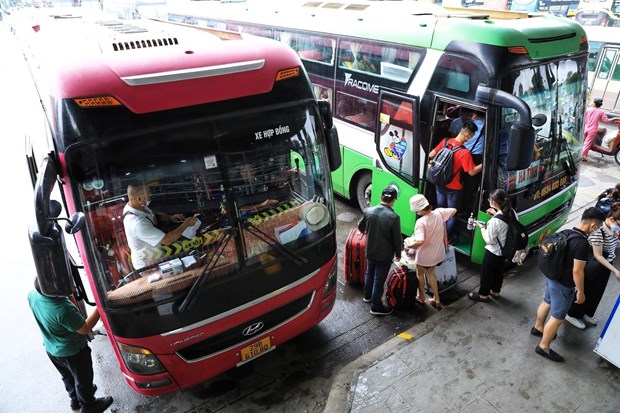 Passengers at Nuoc Ngam bus station in Hanoi. Most fixed-route transport firms have charged their passengers more to offset higher fuel costs. (Photo: VNA)