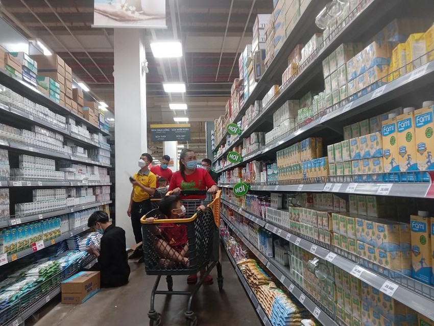 People shopping at a supermarket.