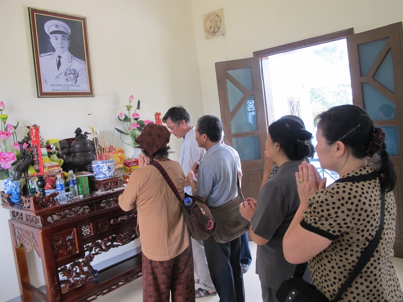 Before going to the historical site of Dien Bien Phu Campaign Command Headquarters in Muong Phang, tourists burn incense sticks in the room where people worship General Vo Nguyen Giap.