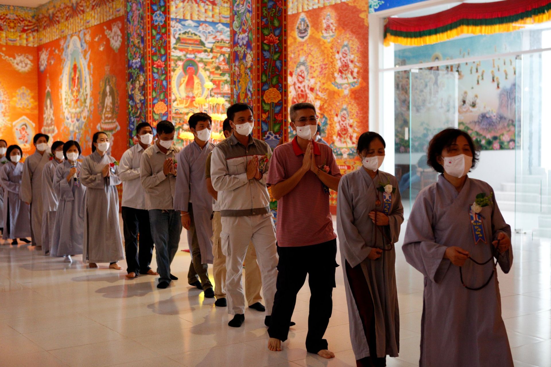 Photo: The line of people circumambulate clockwise 7 times (or 13) around the stupa of enlightenment and prayer.