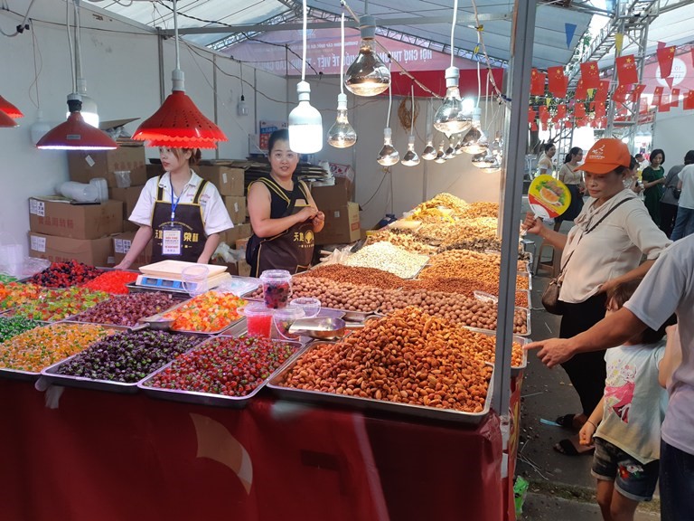 Booth displaying processed food products of enterprises in Yunnan province, China.