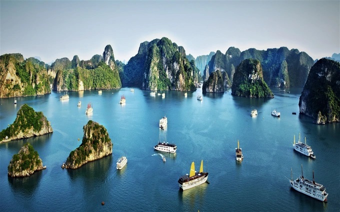 Ha Long Bay, one of the UNESCO-recognised World Natural Heritage Sites, boasts emerald-green waters and nearly 2,000 limestone islands